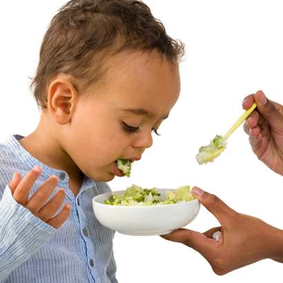 Child spitting out their food back into the bowl