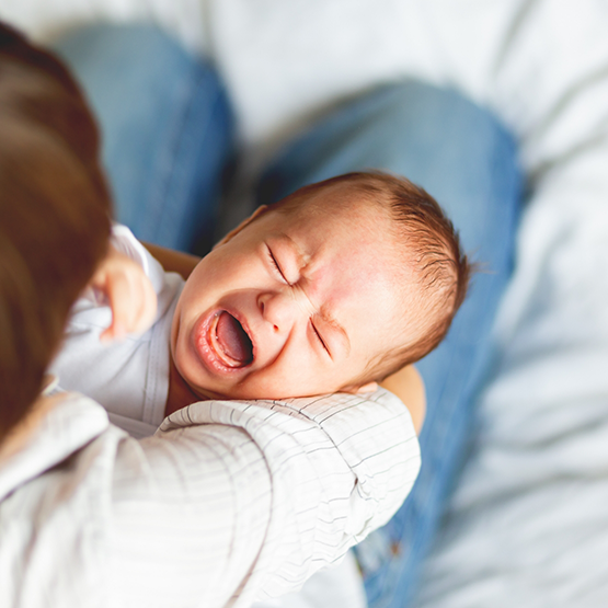 Mother comforting her crying baby